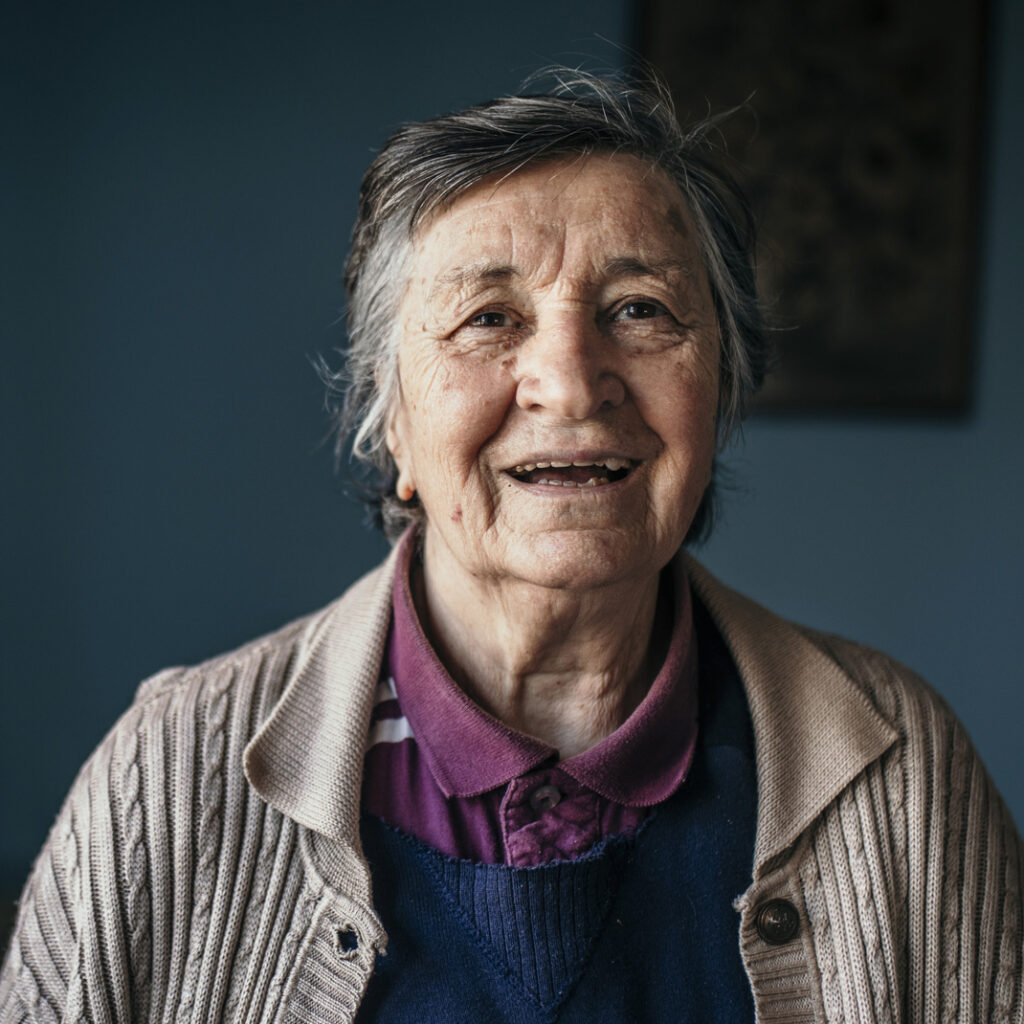 older woman with white streaked hair of Hispanic descent